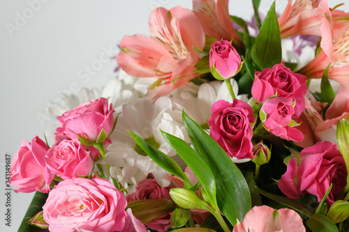 Colorful background of flowers close-up. Bouquet of roses, lilies and chrysanthemums. © Andrii