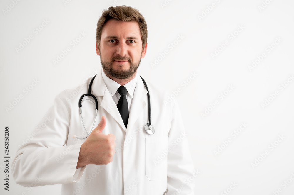 Male doctor with stethoscope in medical uniform showing thumbs up