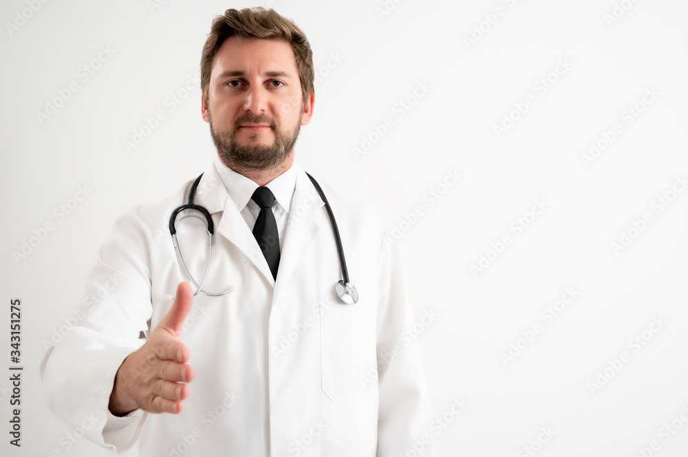 Male doctor with stethoscope in medical uniform shaking hand Male doctor with stethoscope in medical uniform shaking hand