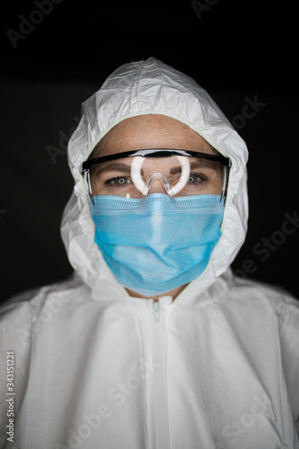 Close up portrait image of a health worker wearing protective clothing and masks working with Vaccines for dangerous viruses