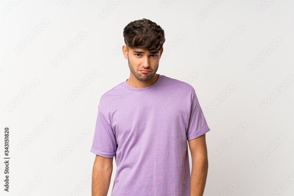 Young handsome man over isolated white background with sad and depressed expression Young handsome man over isolated white background with sad and depressed expression
