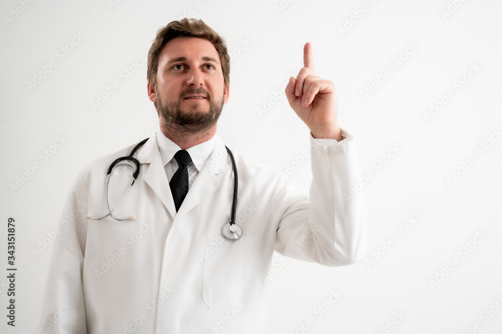 Male doctor with stethoscope in medical uniform with her finger up has come up with an idea Male doctor with stethoscope in medical uniform with her finger up has come up with an idea
