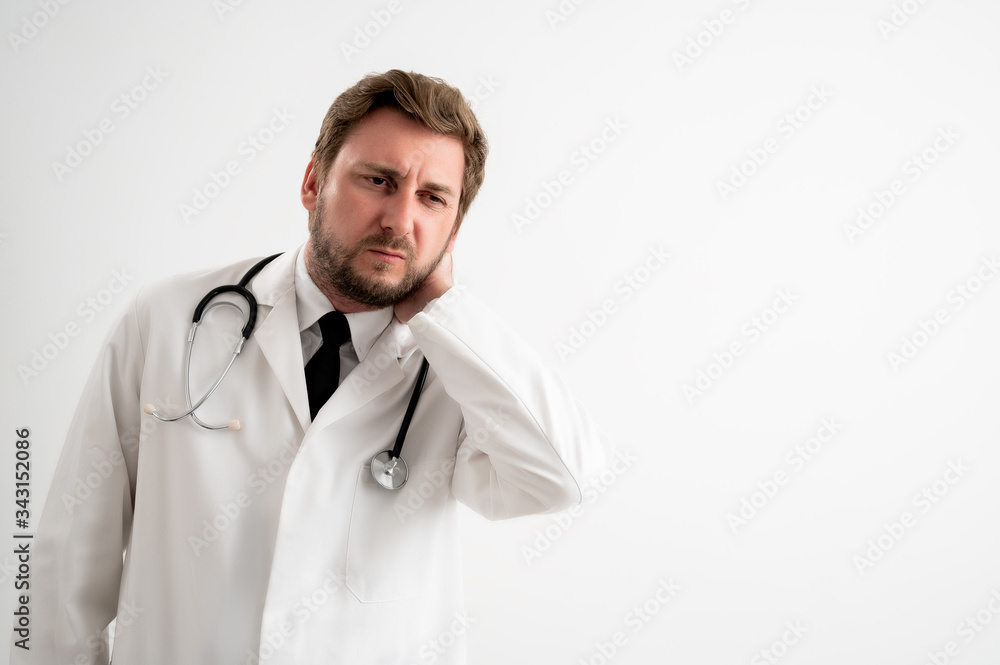 Male doctor with stethoscope in medical uniform has sore throat Male doctor with stethoscope in medical uniform has sore throat