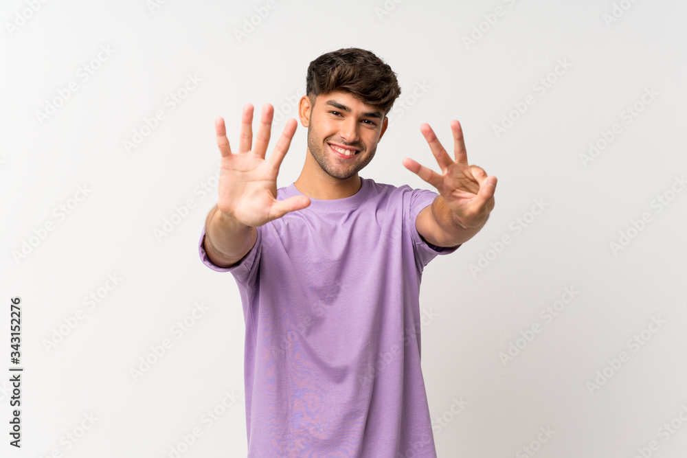 Young handsome man over isolated white background counting eight with fingers Young handsome man over isolated white background counting eight with fingers