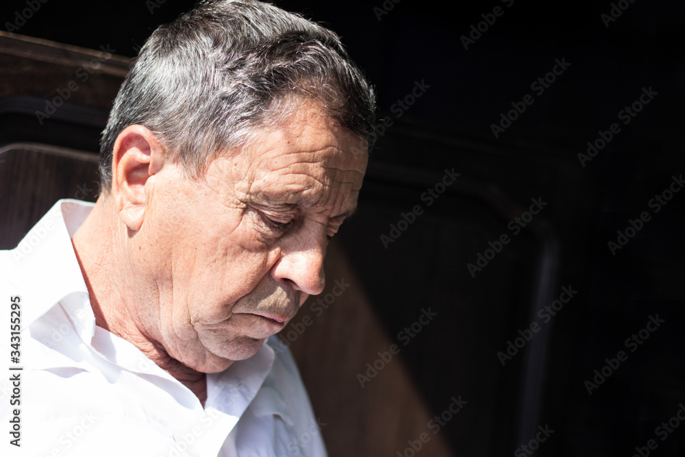 Fototapeta premium Portrait of elderly man lost in thought