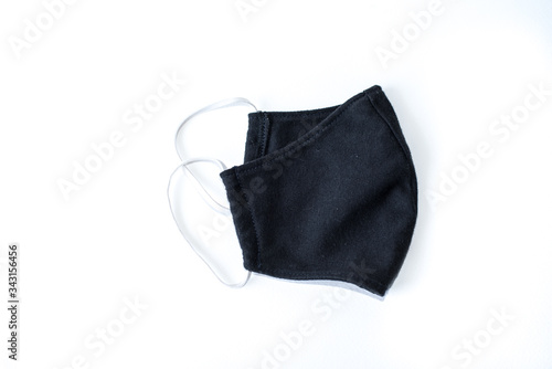A black cloth mask in a white scene