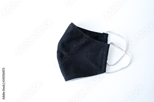 A black cloth mask in a white scene