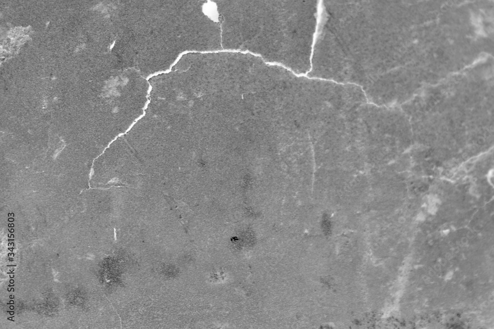 Fototapeta premium Gray dirty background with a white crack.