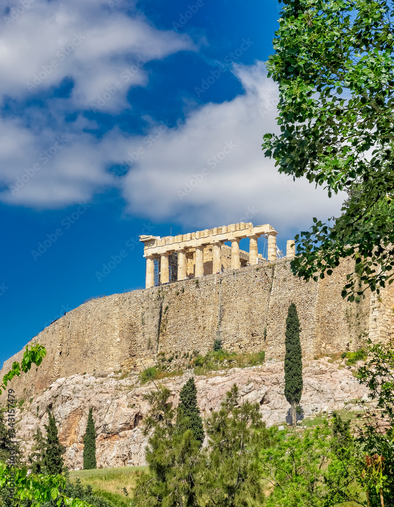 Fototapeta premium Athens Greece, parthenon temple on acropolis hilll and vibrant greeen foliage