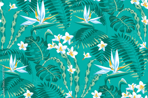 Seamless pattern of tropical leaves and flowers of plumeria and strelitzia on a turquoise background.