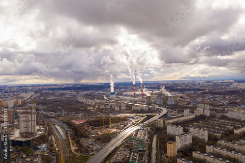 industrial views of a big city at sunset filmed from a drone