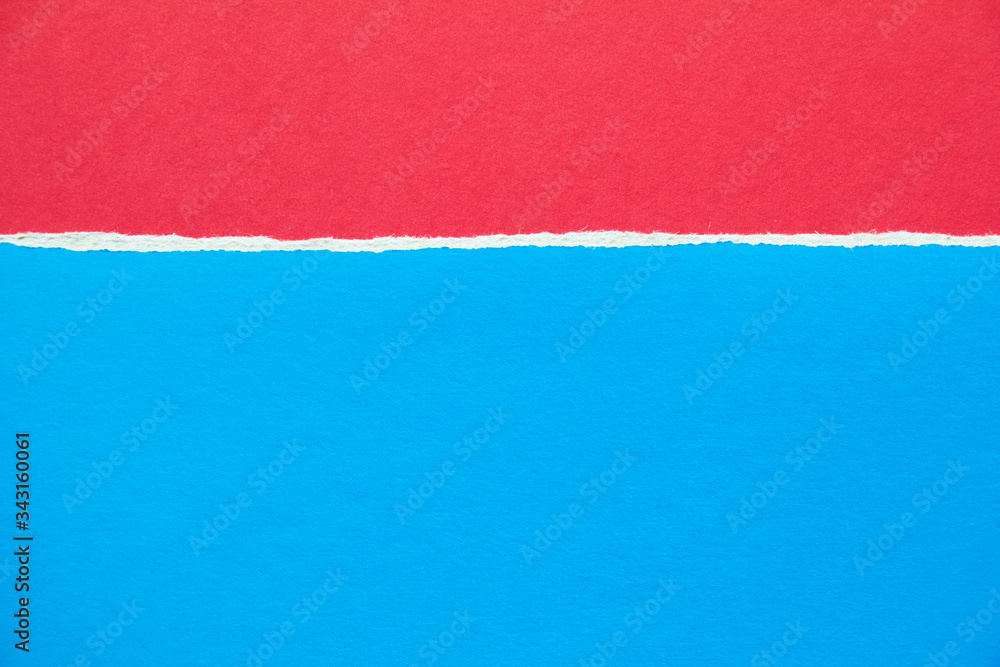 Red and blue torn sheet of cardboard paper texture background. Copy space for text message. Red and blue torn sheet of cardboard paper texture background. Copy space for text message.