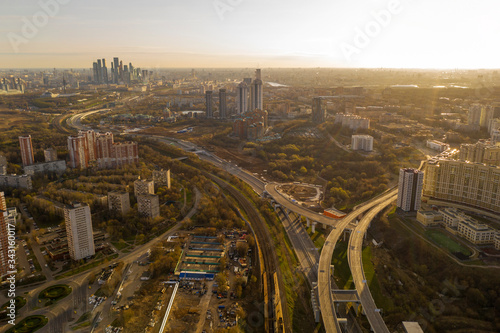 panoramic view with skyscrapers and highways of a big city filmed from a drone