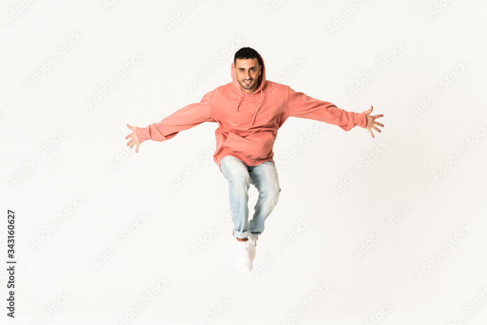 Man dancing street dance style over isolated white background