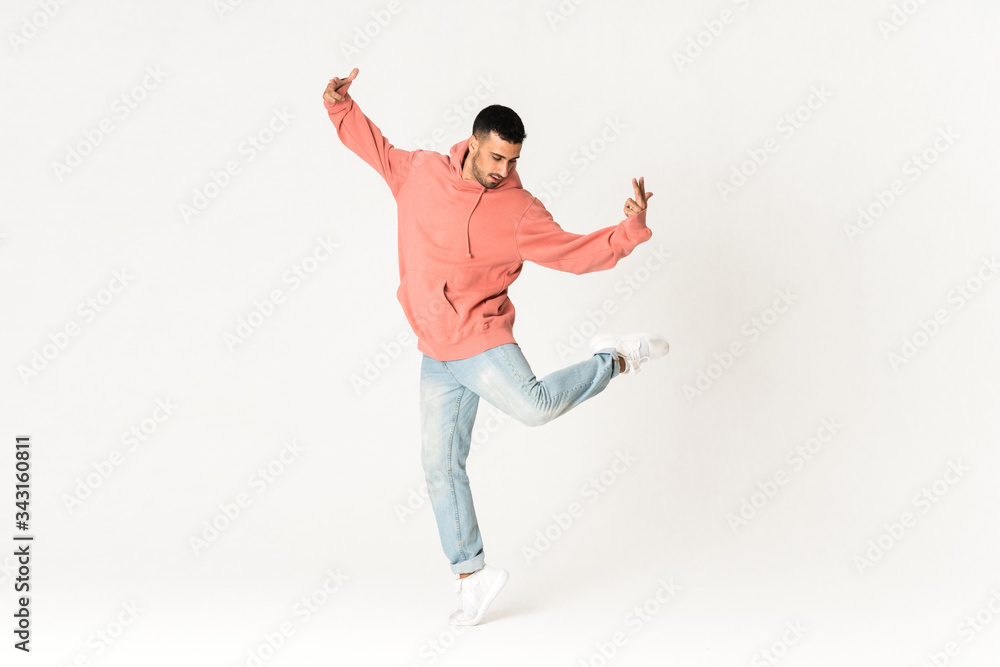 Man dancing street dance style over isolated white background Man dancing street dance style over isolated white background