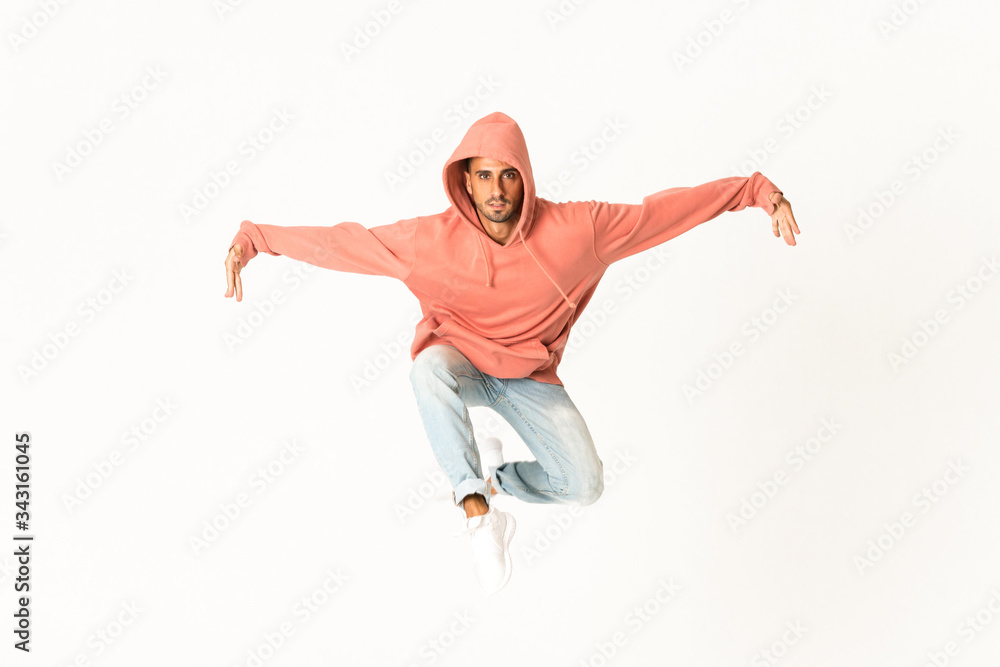 Man dancing street dance style over isolated white background Man dancing street dance style over isolated white background