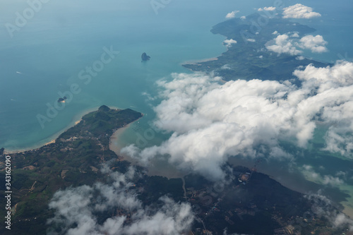 Aerial view of sea islands and clouds from the plane.