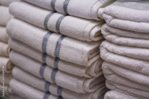 Cuadro en lienzo Pile of new towels in shop on a regiment, shallow depth of field, texture background