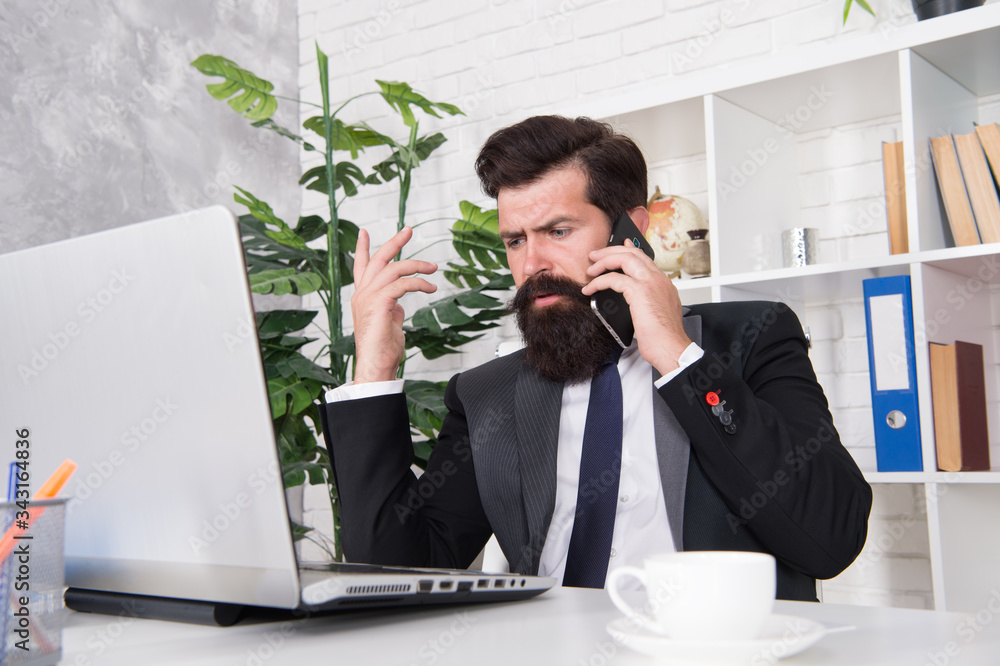 Managing everything. Manager talk on phone in office. Office manager work at desk. Project manager use new technology for business. General manager or director. Business communication. Modern life Managing everything. Manager talk on phone in office. Office manager work at desk. Project manager use new technology for business. General manager or director. Business communication. Modern life