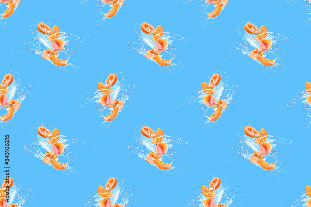 seamless pattern apricot slices in water splash on a blue background