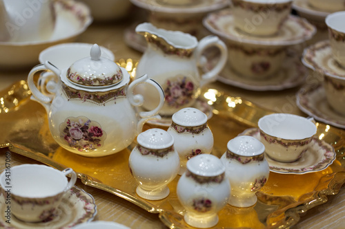 Wallpaper Mural Luxury white ceramic tea set on a golden platter  Torontodigital.ca