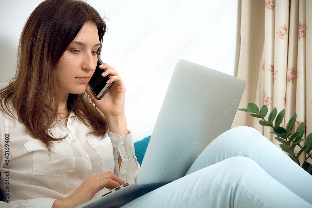 Work from home. Woman runs business from home. Remote work on the internet Work from home. Woman runs business from home. Remote work on the internet