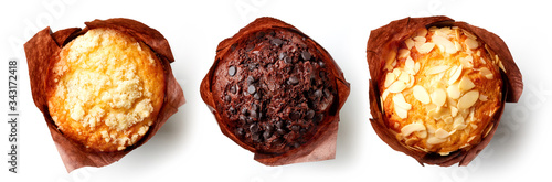 Tableau sur toile Three muffins on white background, from above