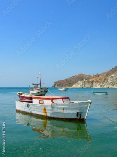 Tranquility by the fisher boats in the little village of Taganga in Colombia. Beautiful shore by the Caribbean coast line.