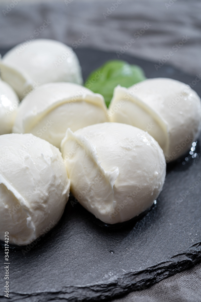 Tasty italian food, fresh white buffalo mozzarella soft cheese balls from Campania Tasty italian food, fresh white buffalo mozzarella soft cheese balls from Campania