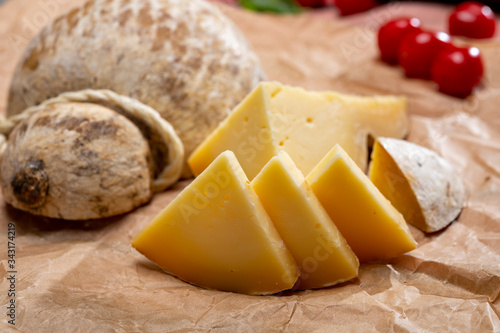 Italian semi hard matured caciocavallo cheese, handmade and aged in natural underground caves in Apulia region