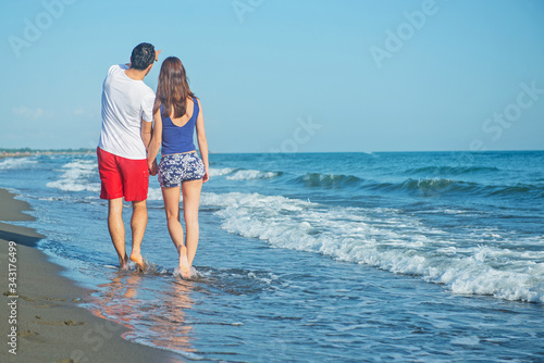 Young happy couple on seashore  © blicsejo