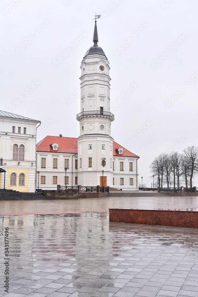 Mogilev, Belarus - March 2020. Beautiful old town in Mogilev city, Belarus. Town hall. 
Mogilev landmark, cultural heritage. City street with historical building.