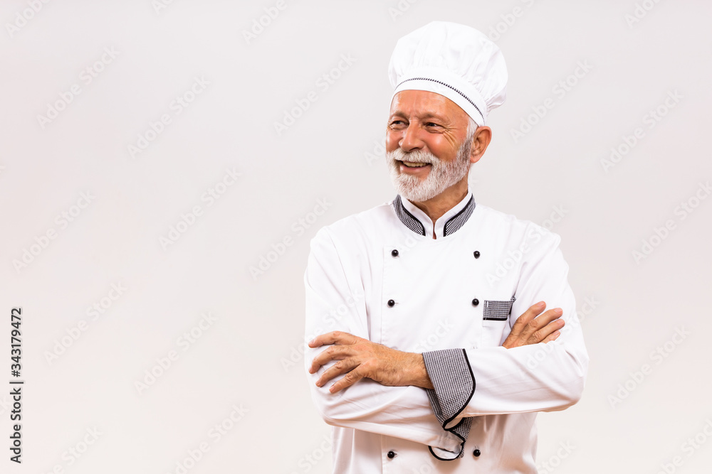 Portrait of senior chef thinking on gray background. Portrait of senior chef thinking on gray background.