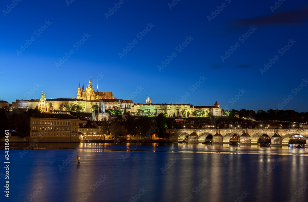 PRAGUE, CZECH REPUBLIC - 2015 SEPTEMBER 28. Night view over the old romantic city of Prague with the Charles bridge and view over the city castle.