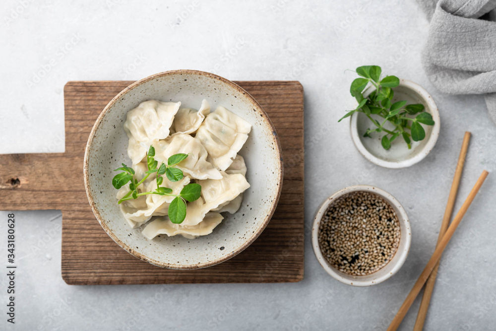 Korean dumplings with soy sauce on a white background , asian food. Korean dumplings with soy sauce on a white background , asian food.