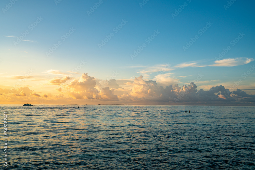 Golden sunset in bikini beach, Maafushi island, Maldives.
