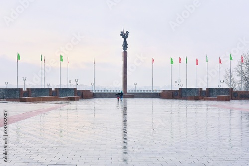 Mogilev, Belarus - March 2020. Memorial complex "Fighters for Soviet Power" in Mogilev. Central square with victory obelisk and eternal flame. Town hall. Mogilev landmark, cultural heritage. 