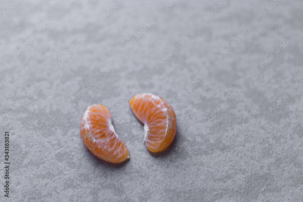 Fresh orange slices with nice textured background.
Fresh orange slices with nice textured background.