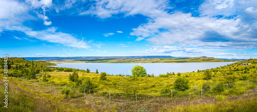 Panoramic view over huge Lagarfjot lake in Iceland at sunny day and blue sky, summer