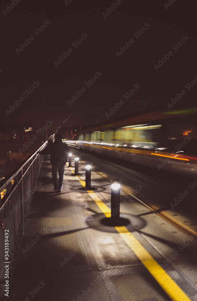 Night train on bridge. Lights by night