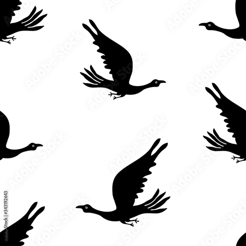 Seamless background of silhouettes flying birds