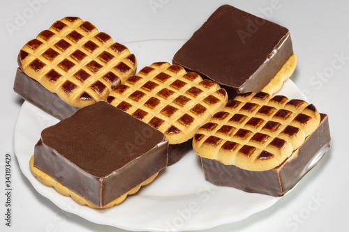 Sandwich cookies with vanilla souffle and chocolate. Sweet food from the shop.