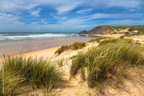 Dunes and sea landscape at the Amoreira beach in Portugal