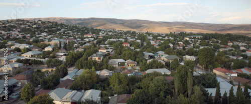 Wide angle panoramic view to Shemakhy city, Azerbaijan . View from above Shamakhi region . Clear view of the houses . photo