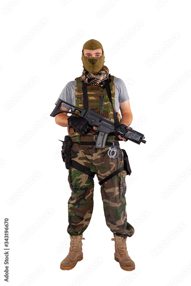 A soldier with uniform and gun isolated on a white background A soldier with uniform and gun isolated on a white background