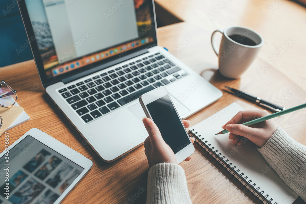 Young woman working in a home office. Remote work concept. Young woman working in a home office. Remote work concept.