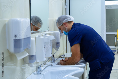 Surgical hand disinfection.The doctor washes his hands  disinfect their hands before surgery.