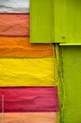 Abstract of Pastel Colored Brick Wall with Old Electrical Wiring