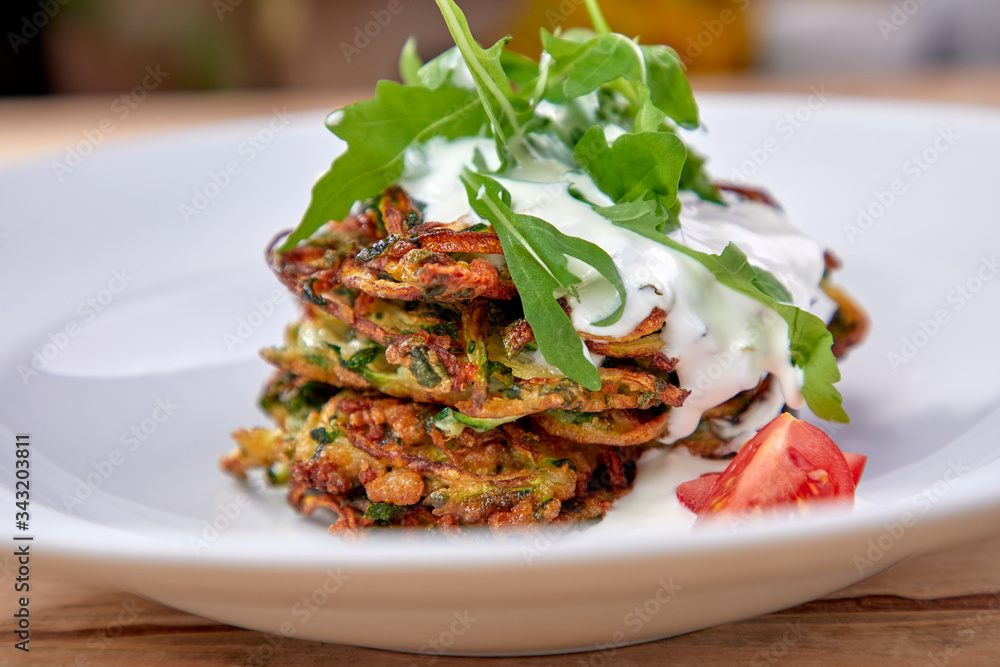 zucchini pancakes with sour cream and herbs