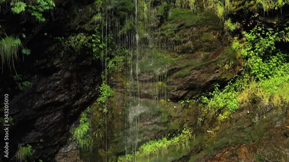 Clean small waterfall in the forest. Beautiful Nature Norway natural landscape. Clean small waterfall in the forest. Beautiful Nature Norway natural landscape.